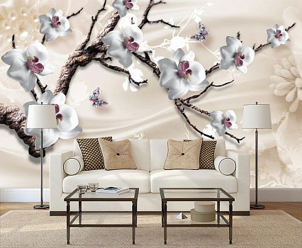 Белая орхидея на ветке в интерьере гостиной с диваном