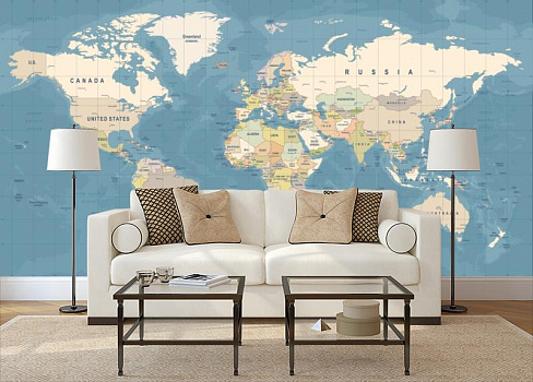 Карта мира на голубом фоне в интерьере гостиной с диваном
