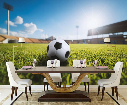 Футбольный мяч на стадионе в интерьере кухни с большим столом
