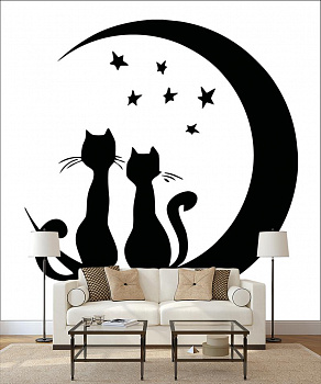Черные кошки в интерьере гостиной с диваном