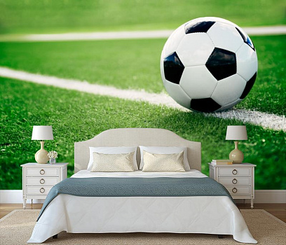 Футбольный мяч на траве в интерьере спальни