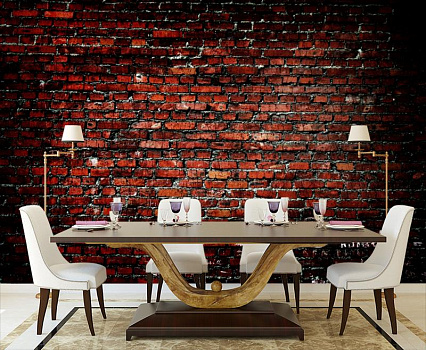Черно-красная стена из кирпича в интерьере кухни с большим столом