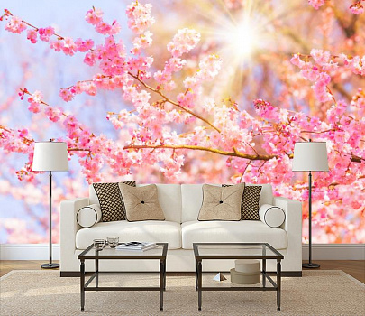 Цветущие деревья весной в интерьере гостиной с диваном