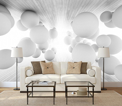 Парящие белые шары в интерьере гостиной с диваном