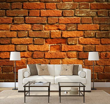 Кирпичная стена с изъяном в интерьере гостиной с диваном