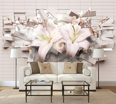 Белые лилии на белом кирпиче в интерьере гостиной с диваном
