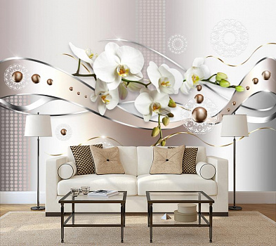 Белая орхидея с лентой в интерьере гостиной с диваном