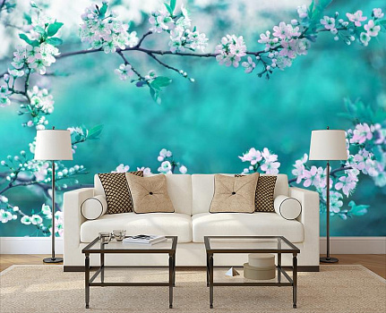 Цветущая ветвь в интерьере гостиной с диваном