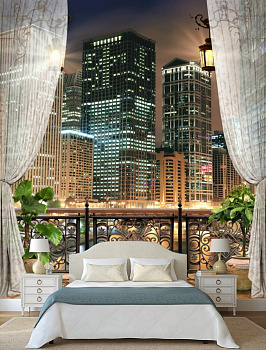 Балкон с видом на ночной город в интерьере спальни