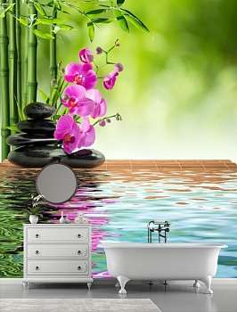 Розовая орхидея с черными камнями в интерьере ванной
