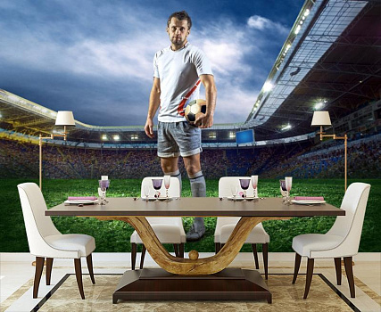 Футболист на зеленом поле в интерьере кухни с большим столом