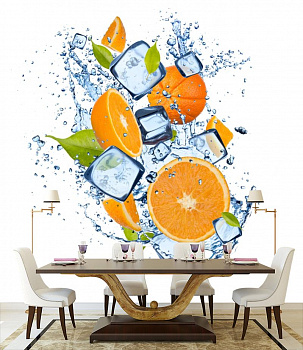 Апельсины и лед в интерьере кухни с большим столом